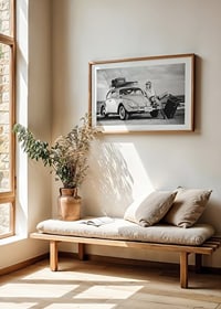 Black and white vintage photograph of woman by Volkswagen Beetle-8