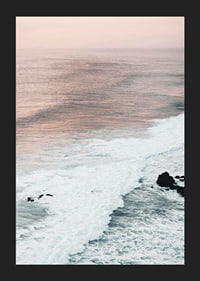 Photograph of ocean waves against coastal rocks in soft pink tones-5