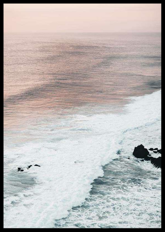Photograph of ocean waves against coastal rocks in soft pink tones-12