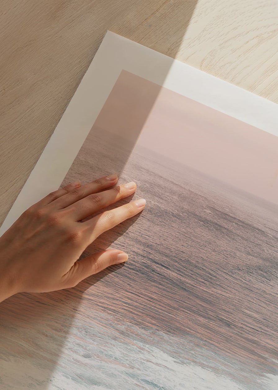 Photograph of ocean waves against coastal rocks in soft pink tones-12