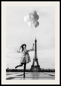Black and white photo of woman with balloons at the Eiffel Tower-2