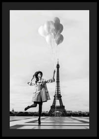 Black and white photo of woman with balloons at the Eiffel Tower-4