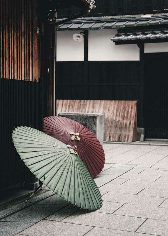 Photograph of red and green Japanese parasol against wooden facade-12
