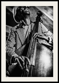 Black and white close-up of man in checkered jacket playing double bass-2