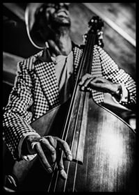 Black and white close-up of man in checkered jacket playing double bass-6