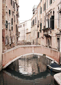 Photograph of Venetian bridge over narrow canal, muted pastels-7