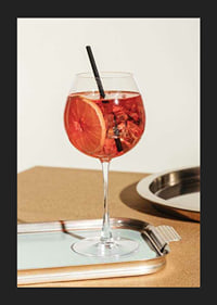 Close-up of Aperol Spritz in wine glass with orange slice-5