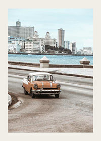 Photograph of orange and white vintage car on boardwalk-3