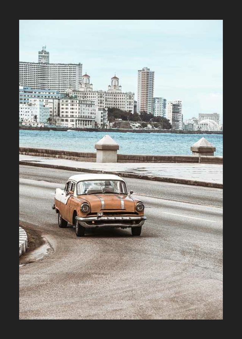 Photograph of orange and white vintage car on boardwalk-12