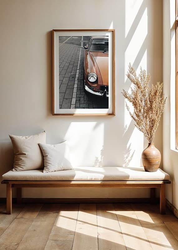 Close-up of orange classic car parked on cobblestones-12