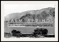Black and white photo of Palm Springs sign with mountains in the background-2