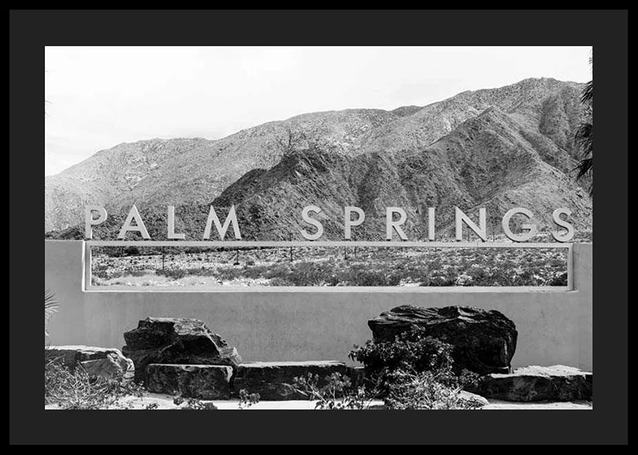 Black and white photo of Palm Springs sign with mountains in the background-12