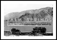 Black and white photo of Palm Springs sign with mountains in the background-0