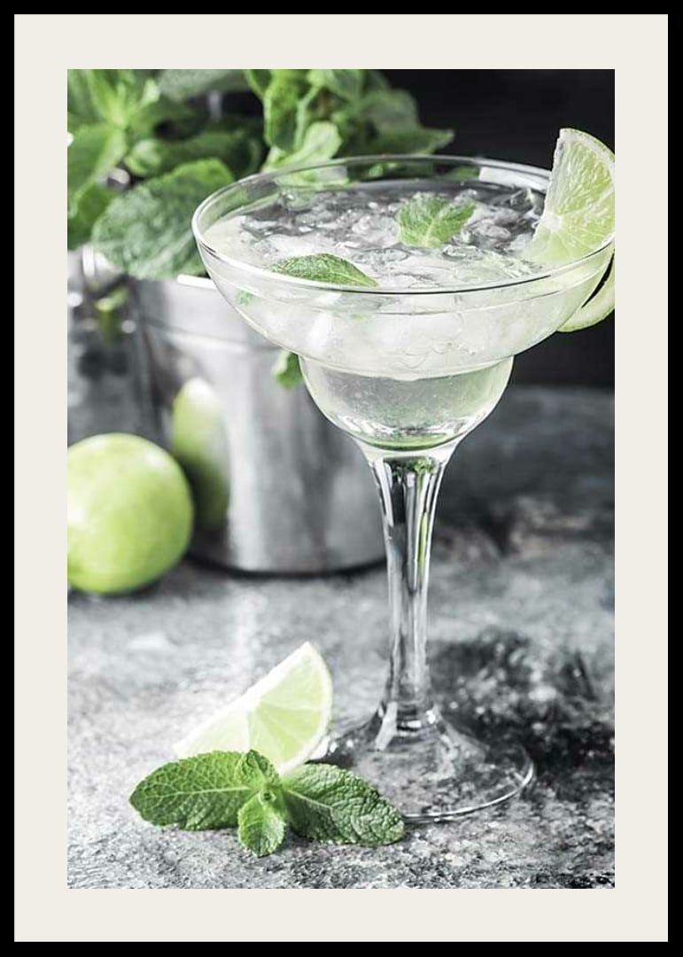 Photograph of margarita in glass with lime and mint leaves-12