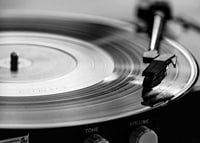 Black and white close-up of vinyl player with vinyl record on it-7