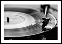 Black and white close-up of vinyl player with vinyl record on it-0