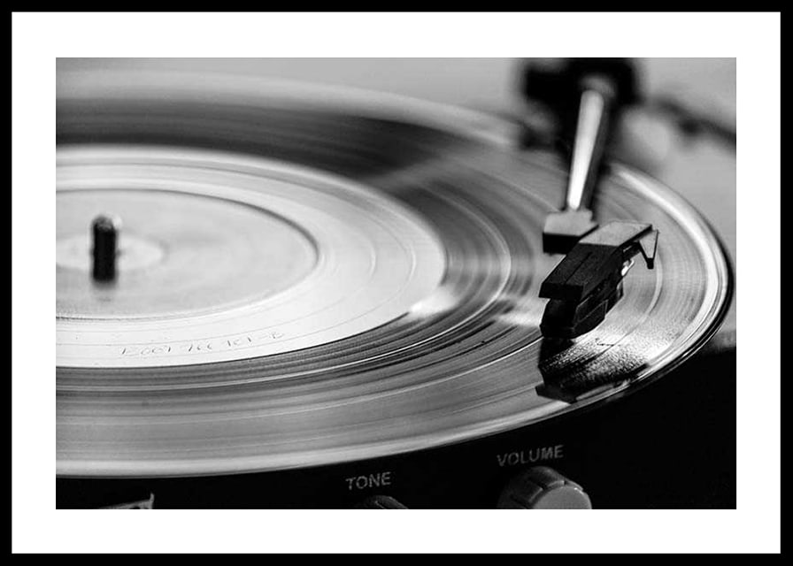 Black and white close-up of vinyl player with vinyl record on it-12