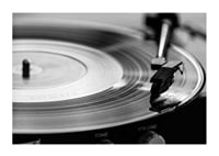 Black and white close-up of vinyl player with vinyl record on it-1