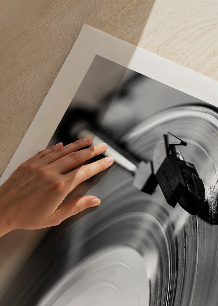 Black and white close-up of vinyl player with vinyl record on it-12