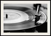 Black and white close-up of vinyl player with vinyl record on it-2