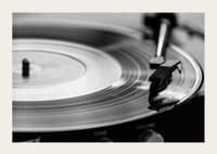 Black and white close-up of vinyl player with vinyl record on it-3