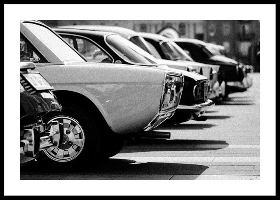 Black and white photography of classic cars in a row in a parking lot-12