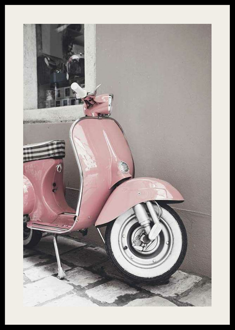 Photograph of pink Vespa scooter in retro style against wall-12