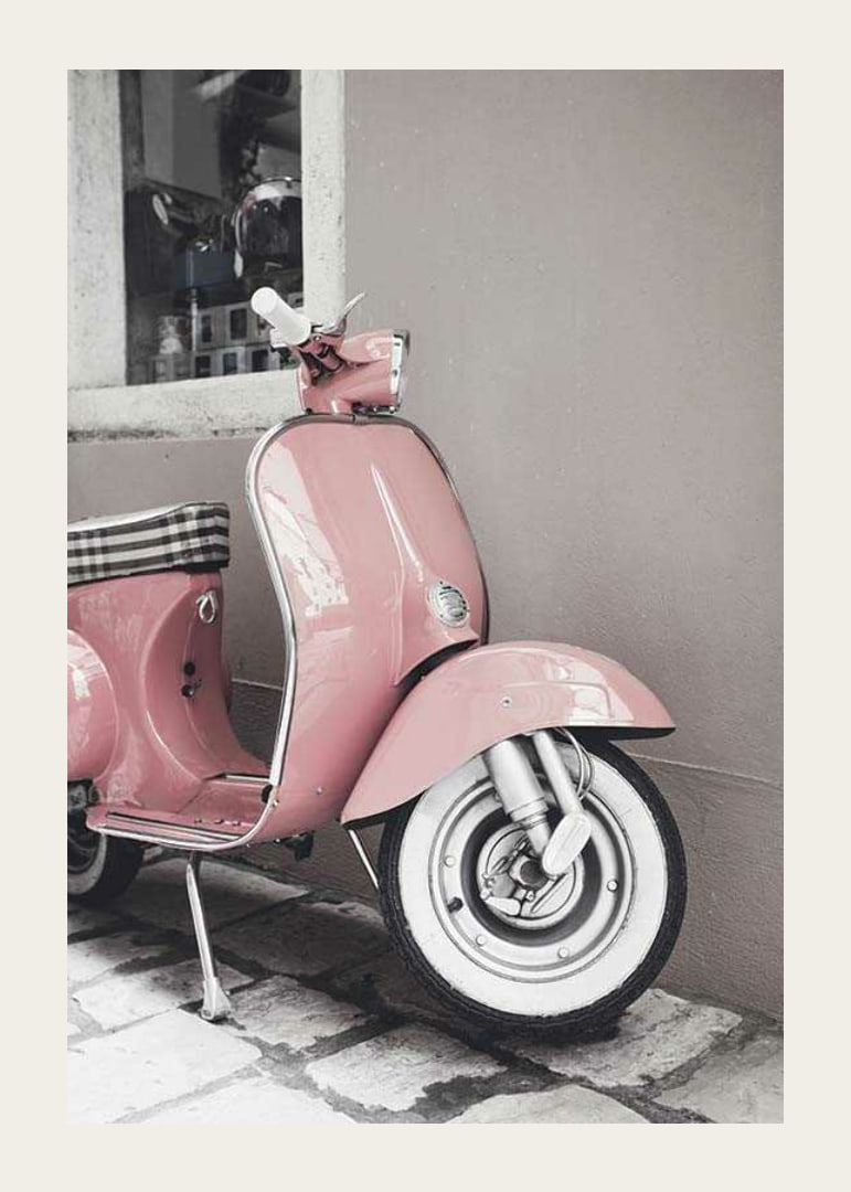 Photograph of pink Vespa scooter in retro style against wall-12