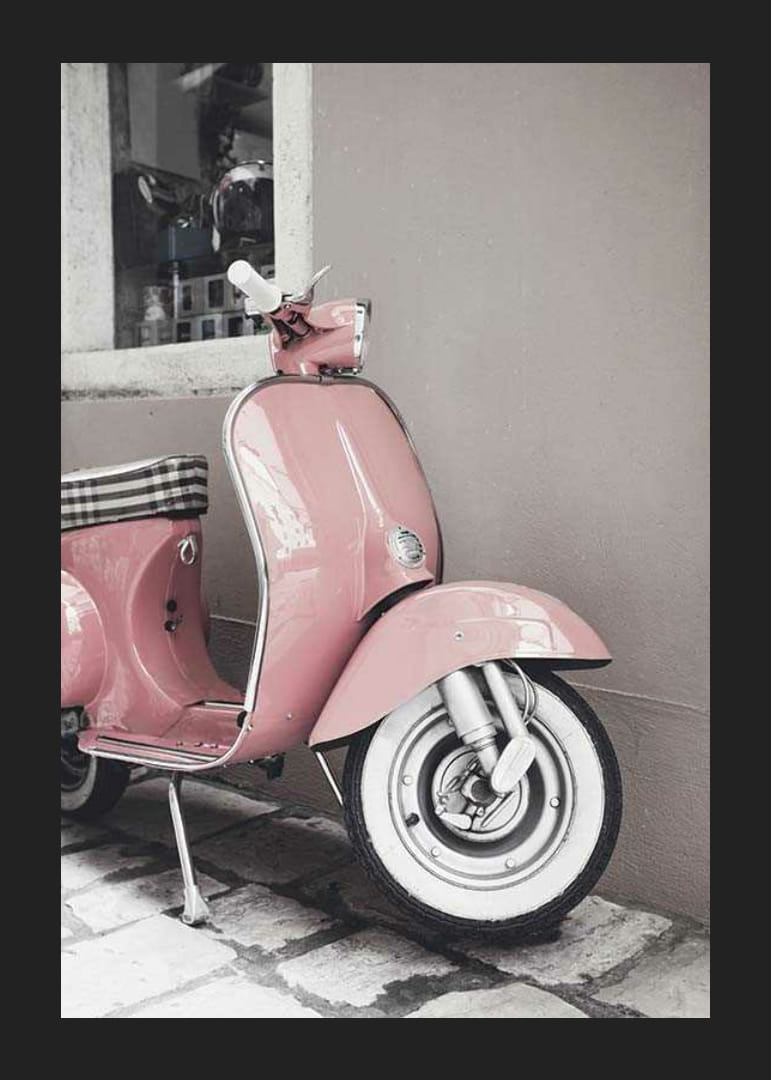 Photograph of pink Vespa scooter in retro style against wall-12