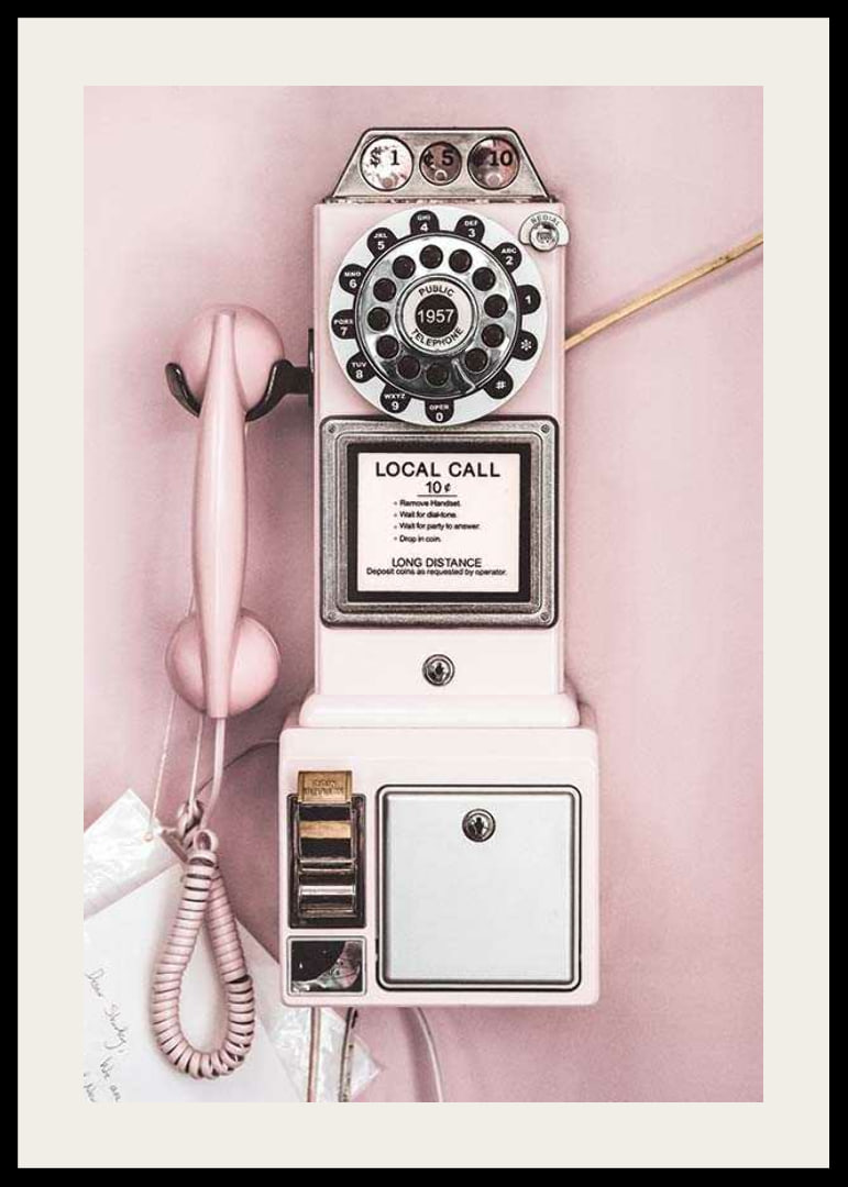 Pink retro payphone with dial on light pink wall-12