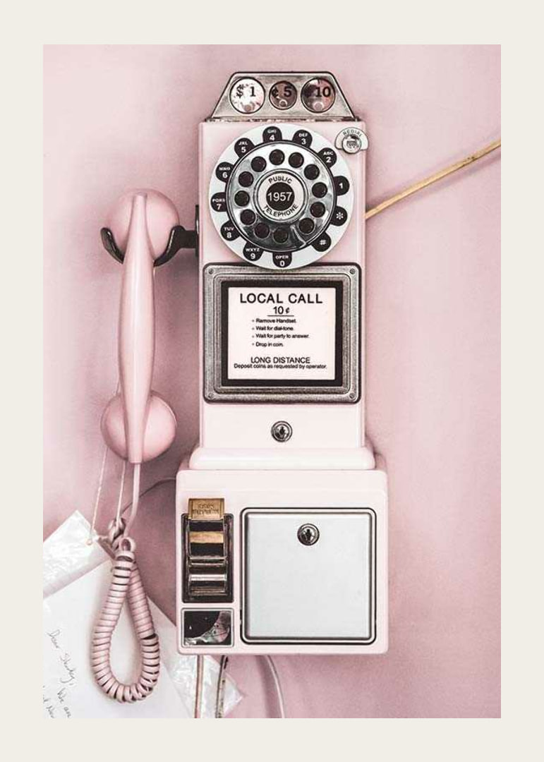 Pink retro payphone with dial on light pink wall-12
