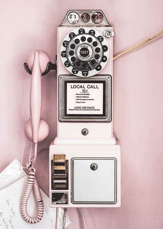Pink retro payphone with dial on light pink wall-12