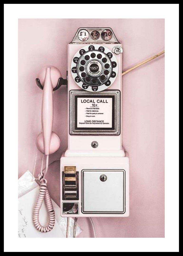 Pink retro payphone with dial on light pink wall-12