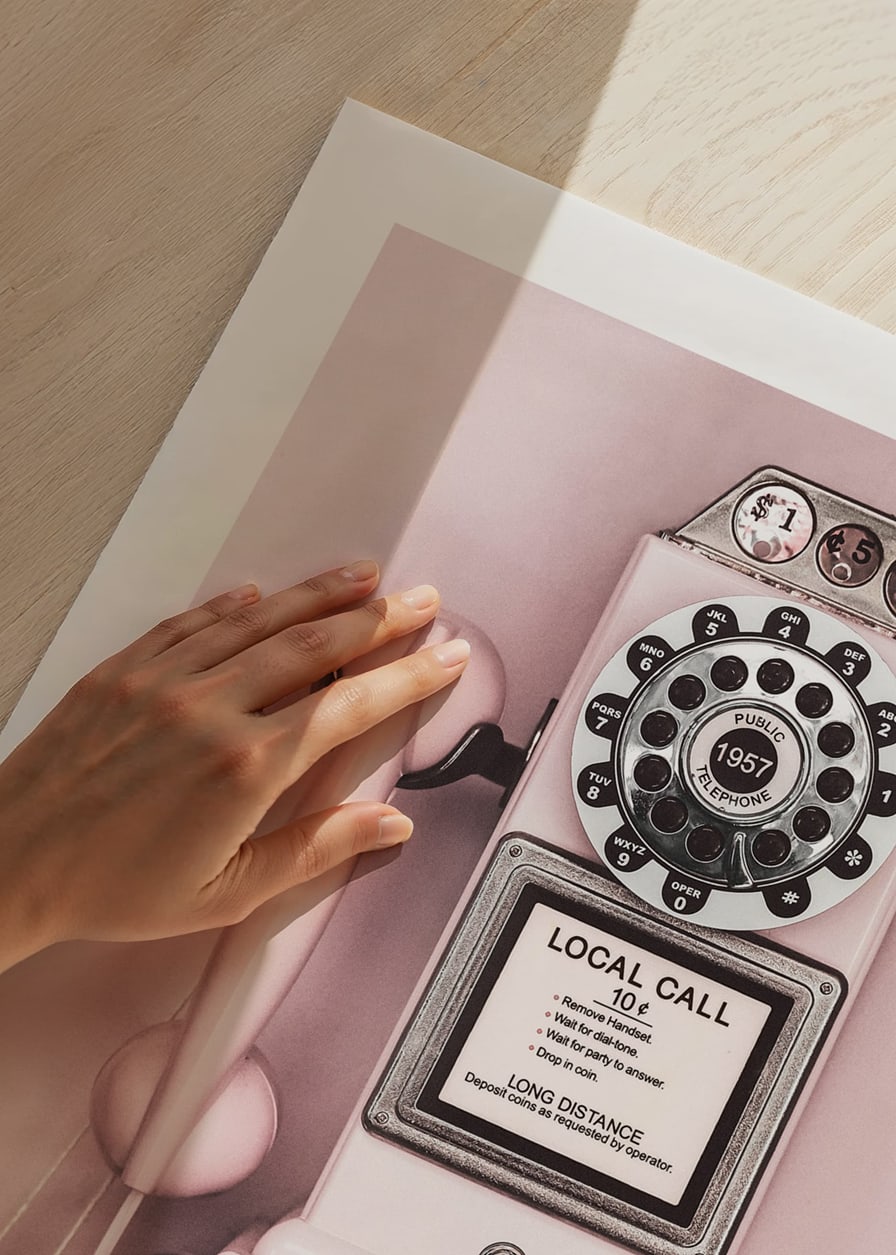 Pink retro payphone with dial on light pink wall-12