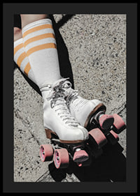 Photograph of white roller skates with pink wheels on asphalt-4