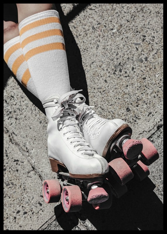 Photograph of white roller skates with pink wheels on asphalt-12