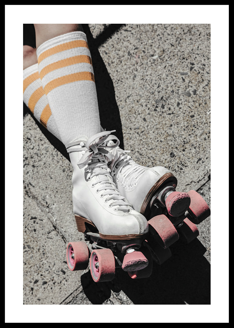 Photograph of white roller skates with pink wheels on asphalt-12