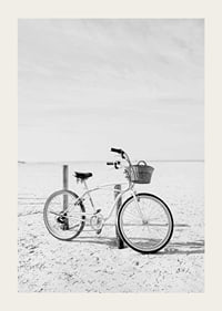 Black and white beach scene with retro bicycle and bicycle basket-3