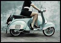 Photograph of woman on light blue retro scooter against gray wall-6