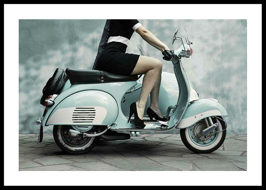 Photograph of woman on light blue retro scooter against gray wall-12