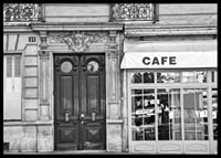 Black and white photo of classic Parisian cafe facade and gate-6