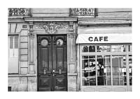Black and white photo of classic Parisian cafe facade and gate-1