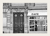 Black and white photo of classic Parisian cafe facade and gate-3