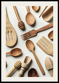 Photograph of various wooden kitchen utensils against a light background-2