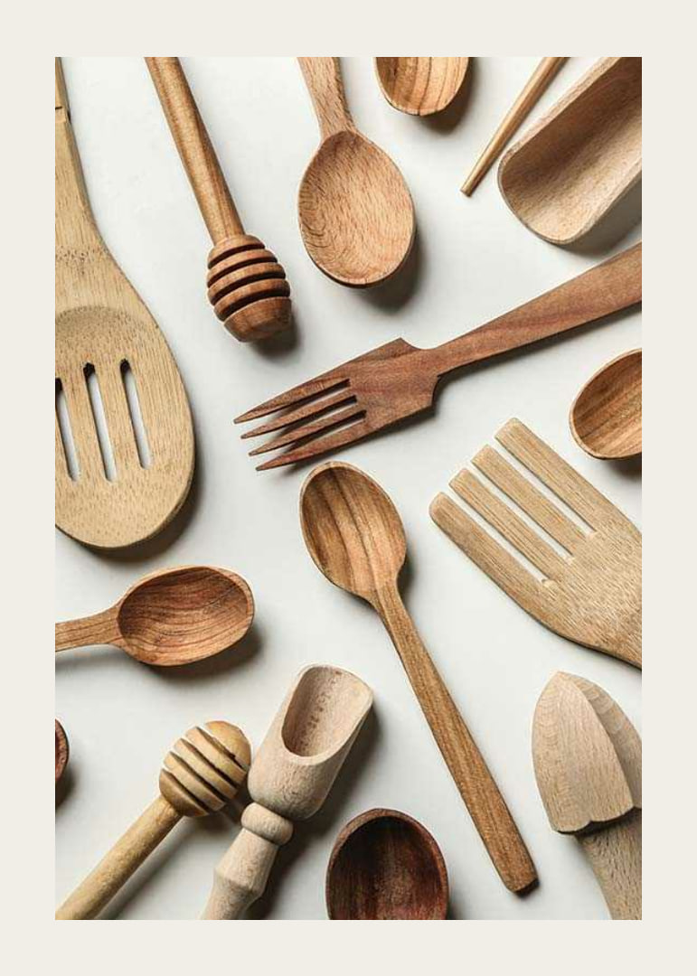 Photograph of various wooden kitchen utensils against a light background-12