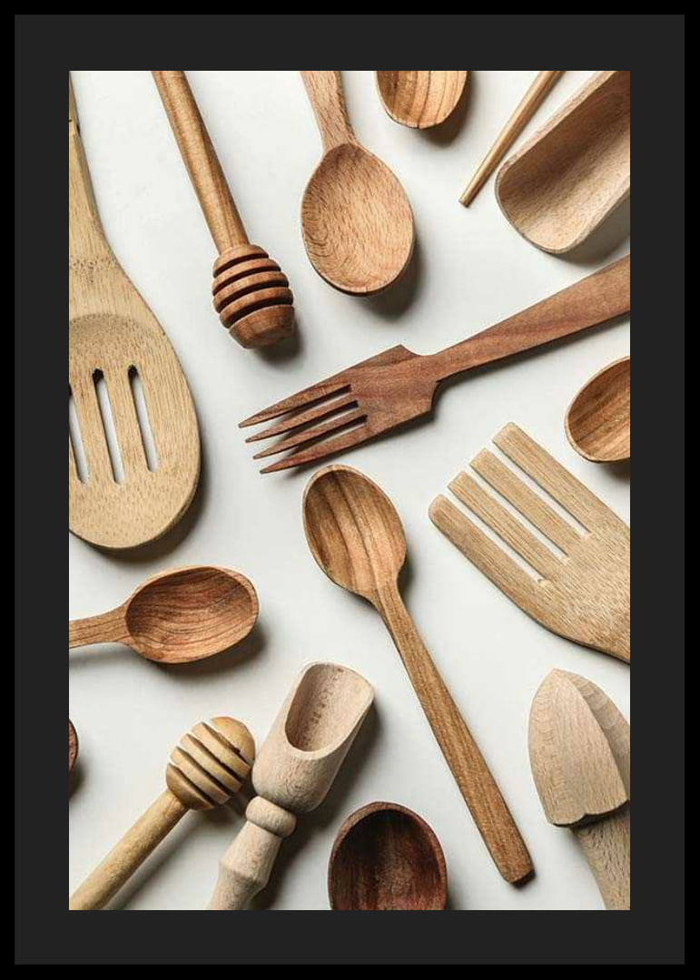 Photograph of various wooden kitchen utensils against a light background-12
