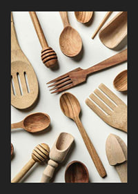 Photograph of various wooden kitchen utensils against a light background-5