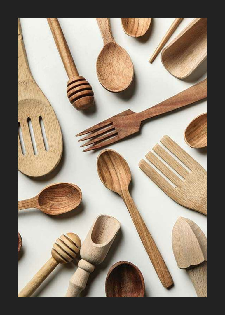 Photograph of various wooden kitchen utensils against a light background-12