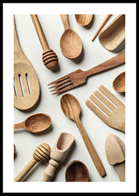 Photograph of various wooden kitchen utensils against a light background-0