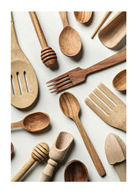 Photograph of various wooden kitchen utensils against a light background-1